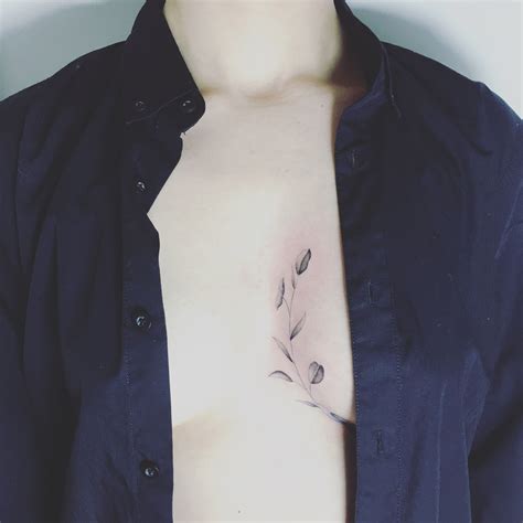 sternum between breast tattoos|20 in